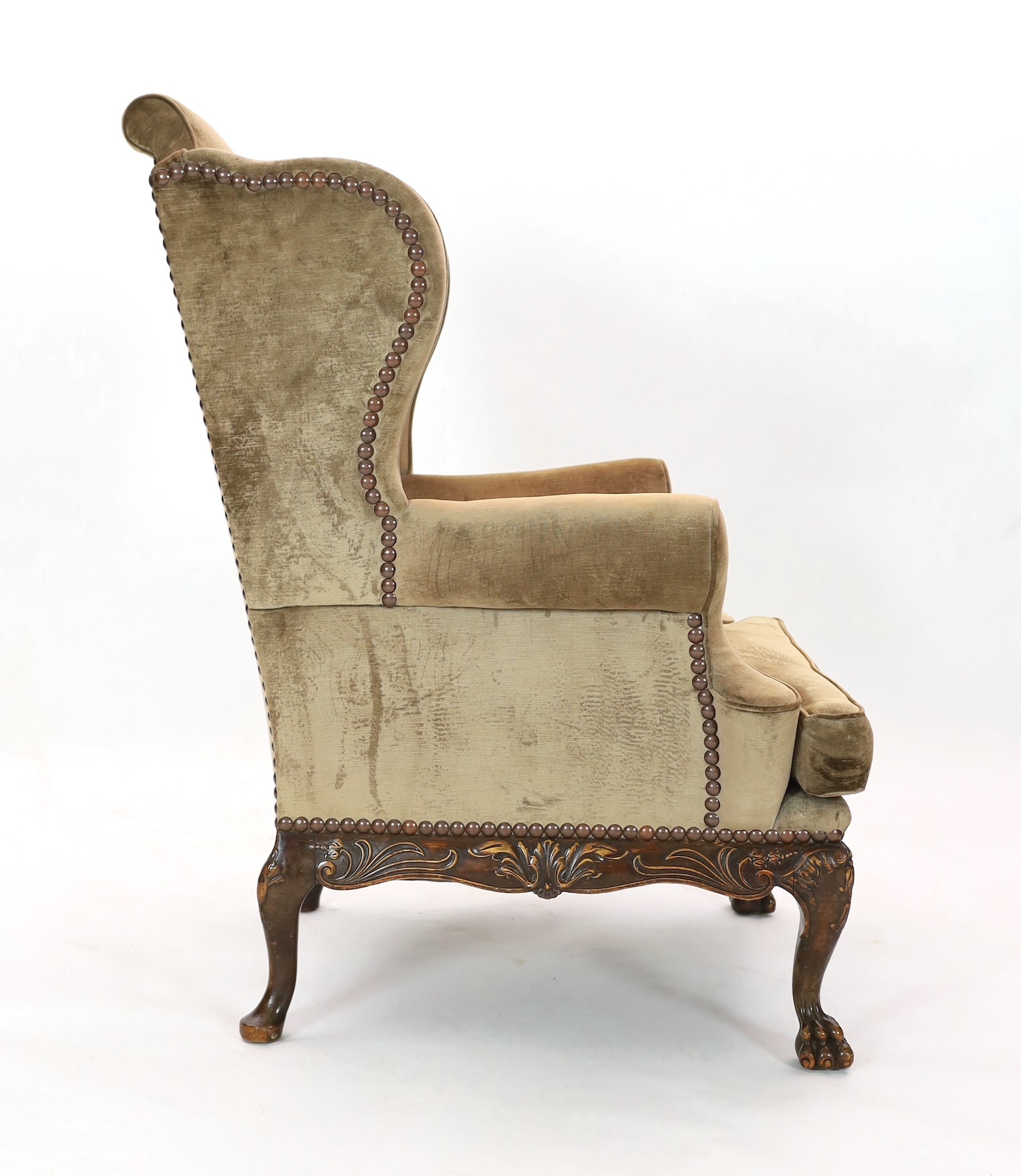 An Irish mahogany wing armchair, width 90cm, depth 98cm, height 120cm